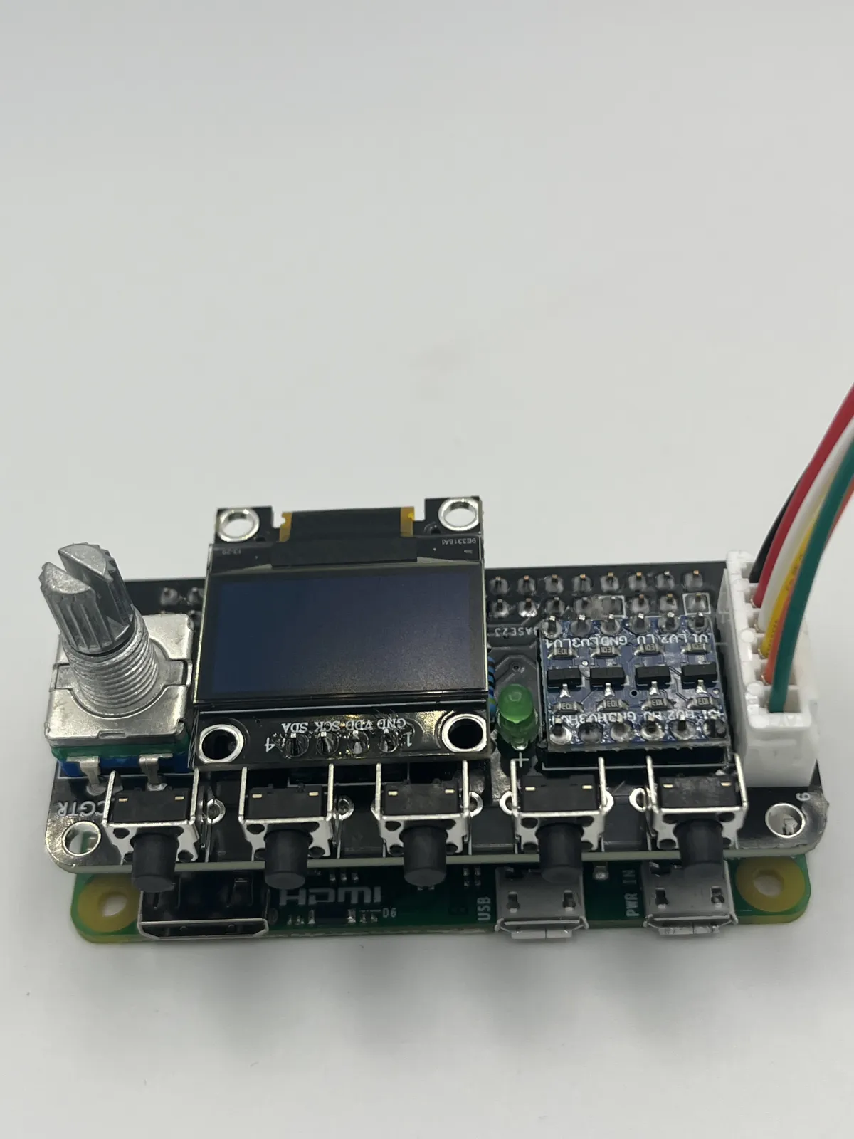 Front view of Pi1541 HAT with OLED display mounted to a Raspberry Pi
